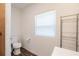 Simple bathroom with toilet and window at 1404 E Frances Ave, Plant City, FL 33563
