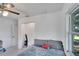Bedroom with double bed, closet and ceiling fan at 1404 E Frances Ave, Plant City, FL 33563