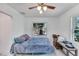 Bedroom with double bed, nightstand and ceiling fan at 1404 E Frances Ave, Plant City, FL 33563