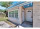 House exterior featuring a front entrance and landscaping at 1404 E Frances Ave, Plant City, FL 33563