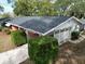Aerial view of the home showing roof and landscaped yard at 5824 11Th St, Zephyrhills, FL 33542