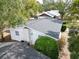 Aerial view of the roof and backyard showing mature trees surrounding property at 5824 11Th St, Zephyrhills, FL 33542
