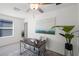 Home office with desk, chair, and large artwork at 6267 Back Forty Loop, Zephyrhills, FL 33541