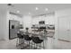 Modern kitchen with white cabinets, granite counters, and stainless steel appliances at 6267 Back Forty Loop, Zephyrhills, FL 33541