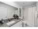 Bathroom with shower/tub combo and granite countertop at 6267 Back Forty Loop, Zephyrhills, FL 33541