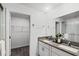 Bathroom boasts double vanity with granite countertop at 6267 Back Forty Loop, Zephyrhills, FL 33541