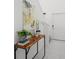 Bright entryway with console table, art, and plants at 6267 Back Forty Loop, Zephyrhills, FL 33541