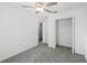Simple bedroom with ceiling fan and walk in closet at 6267 Back Forty Loop, Zephyrhills, FL 33541