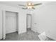 Bright bedroom with ceiling fan and walk in closet at 6267 Back Forty Loop, Zephyrhills, FL 33541