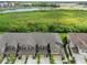 Aerial view of townhomes near a lake and conservation area at 11826 Sky Acres Ter, Bradenton, FL 34211