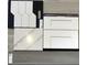 New Haven kitchen design with white cabinets, quartz countertops, and hexagon tile at 16227 Alpha Grove Pl, Odessa, FL 33556