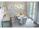 Elegant dining room with chandelier and access to patio at 16227 Alpha Grove Pl, Odessa, FL 33556