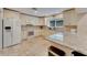 Bright kitchen with white cabinets and granite counters at 7615 Alhambra Dr, Bradenton, FL 34209