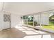 Screened porch with access to backyard at 5824 11Th St, Zephyrhills, FL 33542