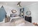 bedroom with mountain mural and rustic-style furniture at 16224 Alpha Grove Pl, Odessa, FL 33556