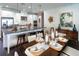 Open kitchen with island, stainless steel appliances, and dining area at 16224 Alpha Grove Pl, Odessa, FL 33556
