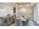 Elegant dining area with chandelier and large buffet at 11209 Manor House Ln, Odessa, FL 33556