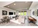 Fun game room with shuffleboard, comfortable seating, and a music area at 11209 Manor House Ln, Odessa, FL 33556