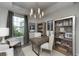 Bright office with built-in shelving and large window at 11209 Manor House Ln, Odessa, FL 33556
