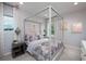 Bright bedroom with canopy bed and natural light at 11209 Manor House Ln, Odessa, FL 33556