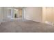 Upstairs hallway with doors to bedrooms and bathroom at 8514 Zapota Way, Tampa, FL 33647