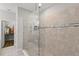 Large walk-in shower with tile surround at 8731 Terracina Lake Dr, Tampa, FL 33625