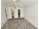 Bedroom with carpet, ceiling fan, and access to bathroom and closet at 6322 Palma Del Mar S Blvd # 215, St Petersburg, FL 33715
