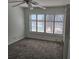 Bedroom with carpet, ceiling fan, and window shutters at 6322 Palma Del Mar S Blvd # 215, St Petersburg, FL 33715