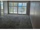 Living room with sliding glass doors leading to balcony and ocean view at 6322 Palma Del Mar S Blvd # 215, St Petersburg, FL 33715