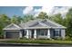 Two-story house with gray siding and a dark gray garage door at 11172 Manor House Ln, Odessa, FL 33556