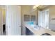 Modern bathroom with double vanity and decorative accents at 11172 Manor House Ln, Odessa, FL 33556