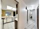 View into kitchen with tiled floors and wood cabinets at 12408 N 52Nd St, Temple Terrace, FL 33617