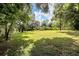 Private backyard with mature trees and shed at 12408 N 52Nd St, Temple Terrace, FL 33617