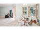 Small dining area with a round glass table and white chairs at 289 Dandelion Ct, Spring Hill, FL 34606