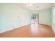 Bedroom with wood flooring and sliding glass doors to backyard at 289 Dandelion Ct, Spring Hill, FL 34606