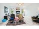 Living room with tiled floors, comfy seating and large windows at 289 Dandelion Ct, Spring Hill, FL 34606