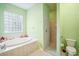 Bathroom with garden tub, shower, and updated fixtures at 289 Dandelion Ct, Spring Hill, FL 34606