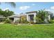 Single-story home with landscaped yard and attached garage at 289 Dandelion Ct, Spring Hill, FL 34606