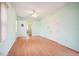Light and airy bedroom with wood flooring and access to bathroom at 289 Dandelion Ct, Spring Hill, FL 34606