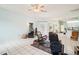 Spacious living room with tile floors and multiple seating areas at 289 Dandelion Ct, Spring Hill, FL 34606