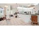 Kitchen with white cabinets, breakfast bar and tile floors at 289 Dandelion Ct, Spring Hill, FL 34606