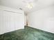 Bright bedroom features a ceiling fan, closet, and neutral wall paint at 26831 Chianina Dr, Wesley Chapel, FL 33544
