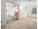 Open living space with sliding glass doors, tile floors, and natural light at 26831 Chianina Dr, Wesley Chapel, FL 33544