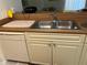 Clean kitchen sink with double basin and dishwasher at 9481 Highland Oak Dr # 505, Tampa, FL 33647