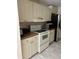 Well-equipped kitchen with ample cabinetry and appliances at 9481 Highland Oak Dr # 505, Tampa, FL 33647