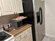 Stainless steel refrigerator and microwave in the kitchen at 9481 Highland Oak Dr # 505, Tampa, FL 33647