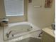 Bathroom with a relaxing jetted bathtub at 9481 Highland Oak Dr # 505, Tampa, FL 33647