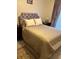 Spacious bedroom with a plush bed and elegant headboard at 9481 Highland Oak Dr # 505, Tampa, FL 33647