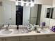 Double vanity bathroom with updated fixtures and ample counter space at 9481 Highland Oak Dr # 505, Tampa, FL 33647