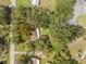 Aerial view of home nestled in a wooded neighborhood at 26831 Chianina Dr, Wesley Chapel, FL 33544